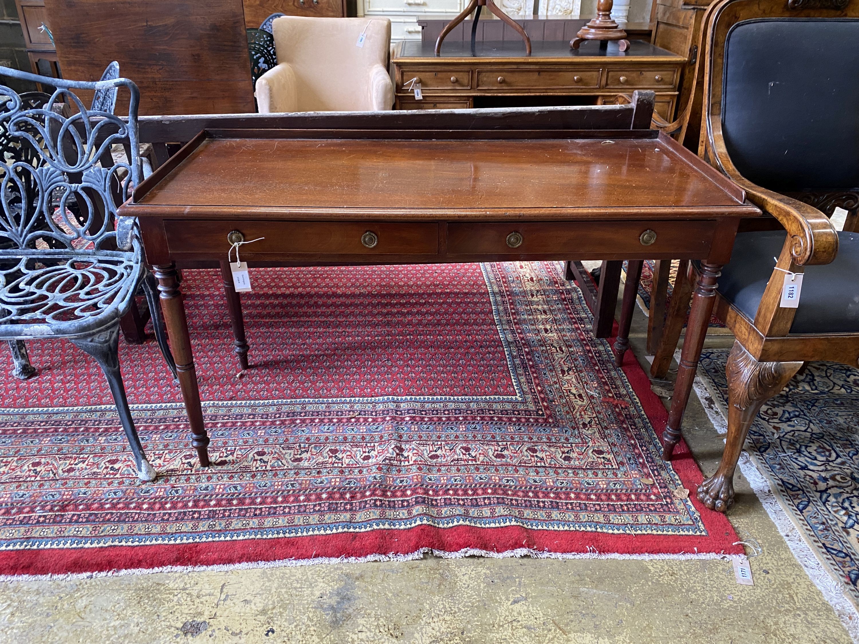 A Victorian mahogany two drawer washstand, with three quarter galleried top, width 135cm, depth 58cm, height 76cm